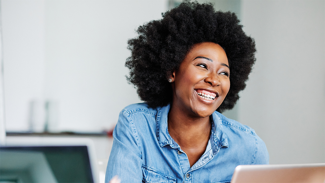 Complete Guide to Student Recruitment and Development: Black woman smiling in the office