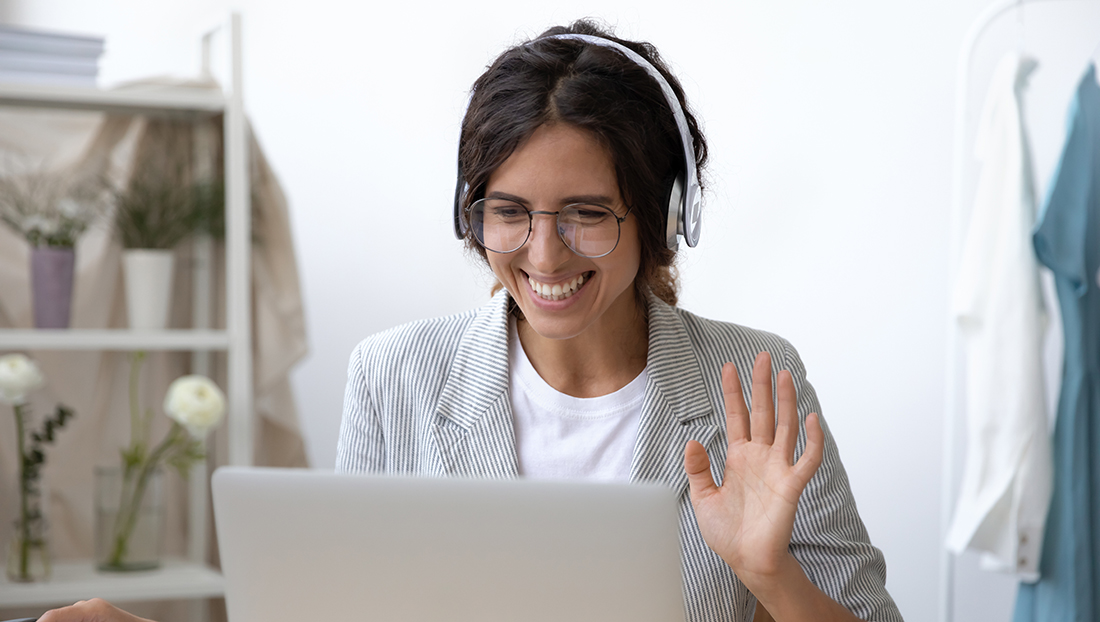 Online assessment centre: young woman smiling during an online interview
