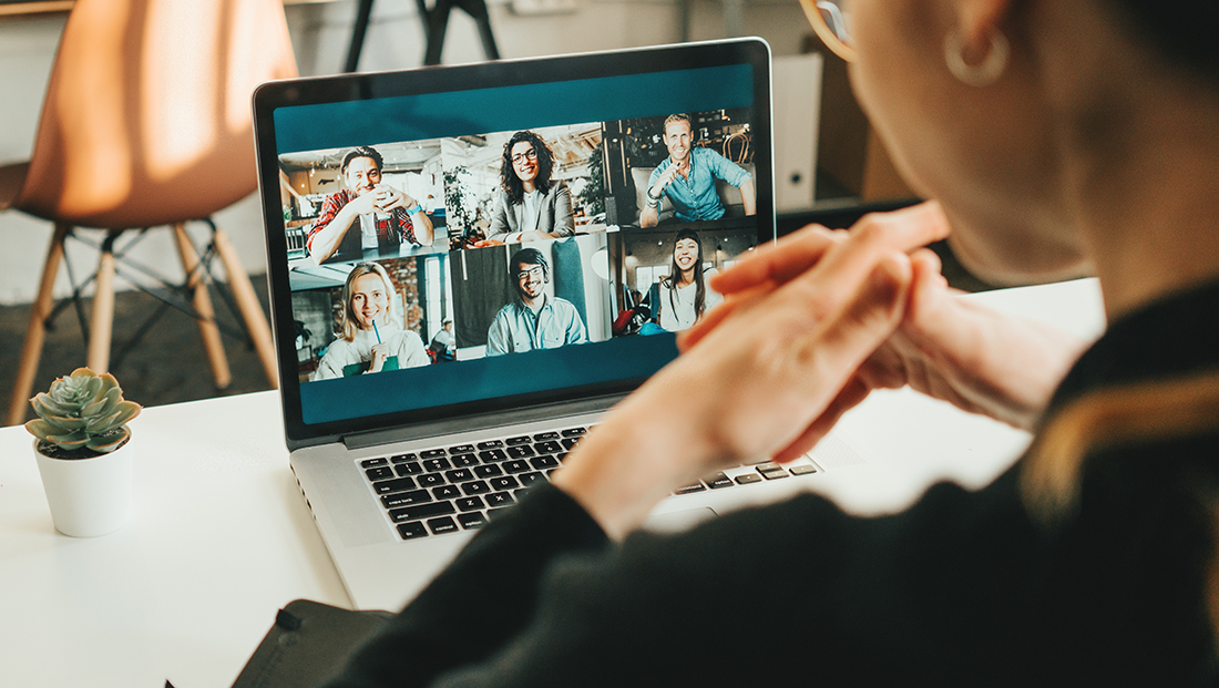 Virtual onboarding: a woman having video conference with her remote team