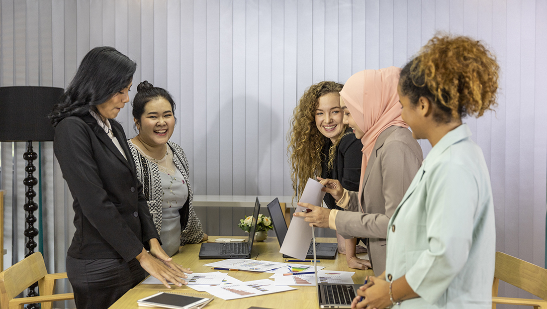 Ethnic minorities: women from different ethnic backgrounds working together in an office