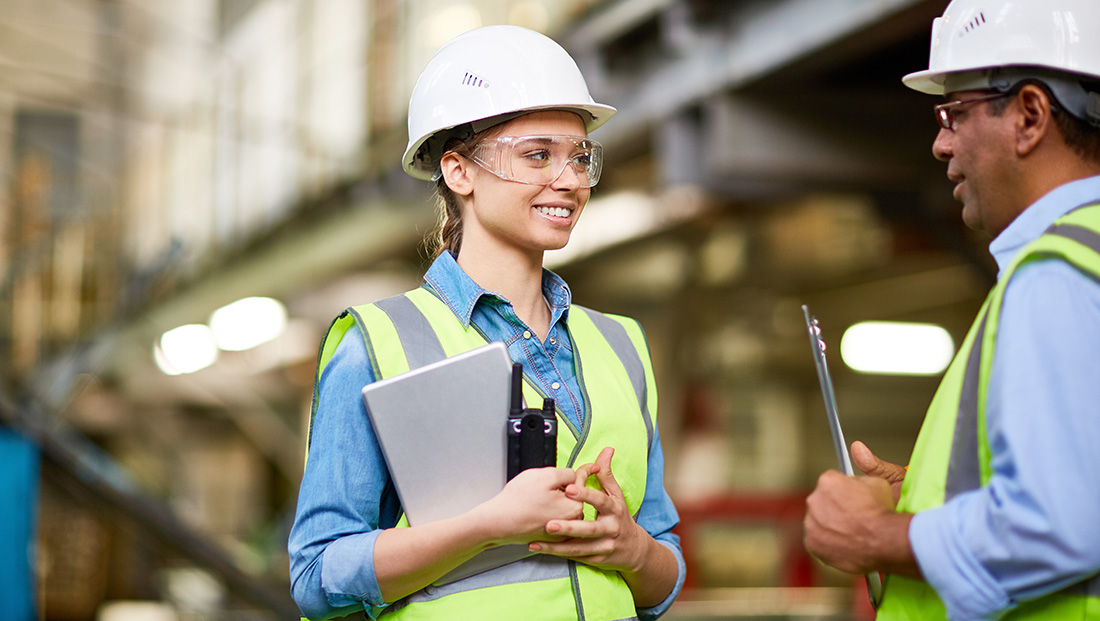 Attract and engage apprentices: an apprentice talking to her supervisor