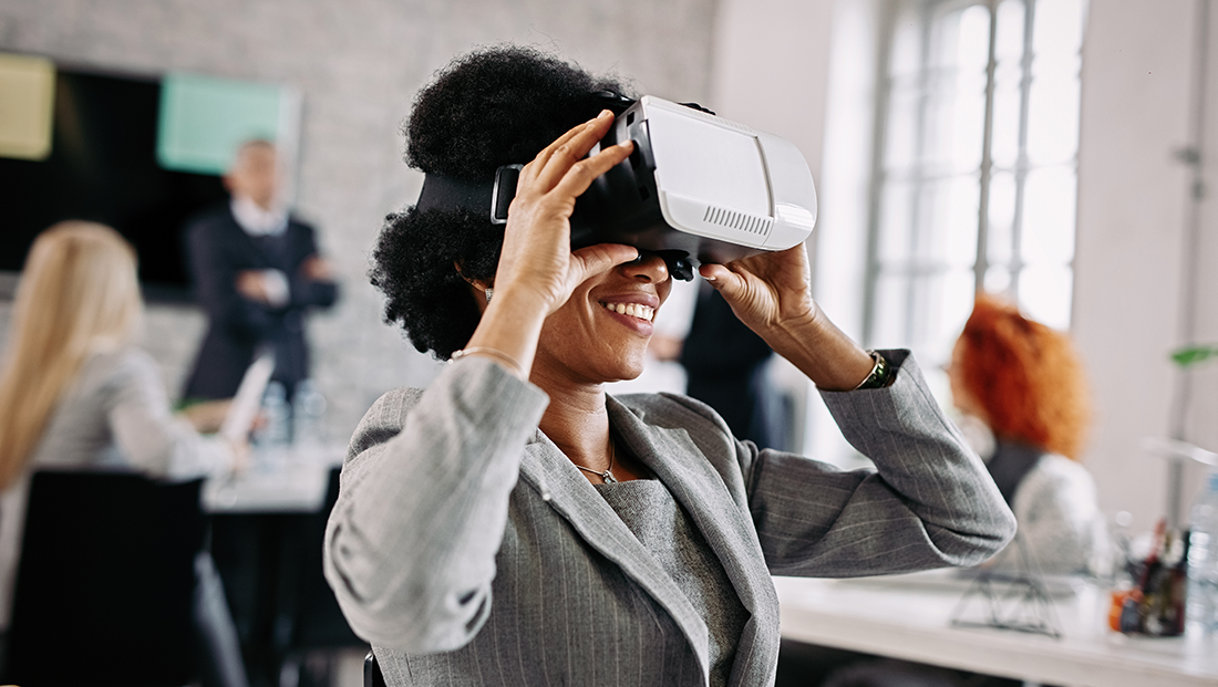 Job simulation: a Black woman using a virtual reality headset in the office