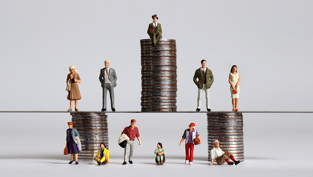 Why the UK is still socially immobile: miniature figurines and stack of coins